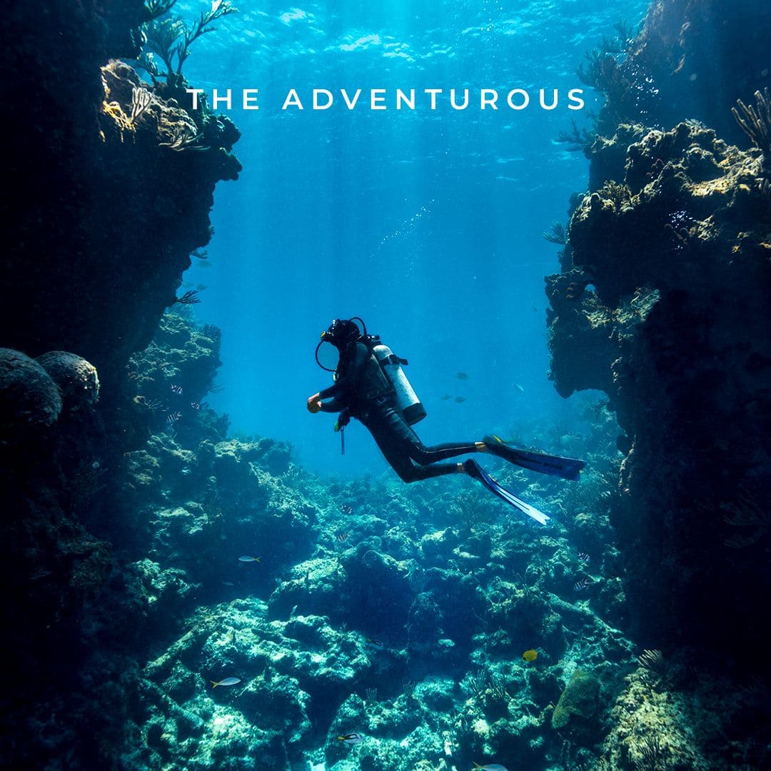 Snorkelers exploring clear turquoise water over a coral reef in Bimini
